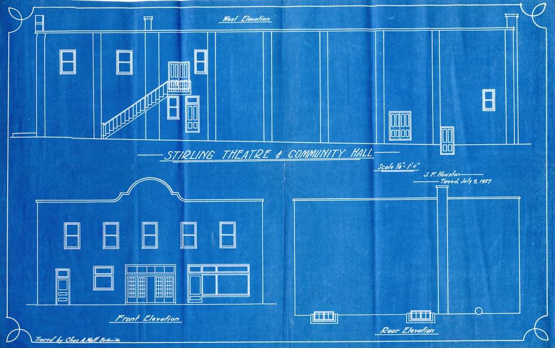Blueprint blueprint-style drawing of Stirling Theatre & Community Hall, showing front, west elevation, and rear elevation details with doors and windows labeled.