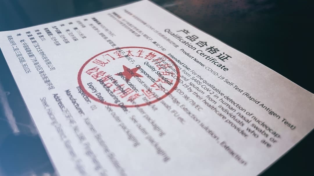 Tilted official-looking certificate page titled 'Qualification Certificate' with a large red circular seal and Chinese/English text beneath the heading.